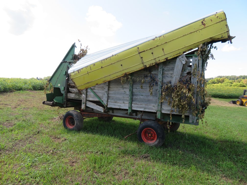 John Deere chopper box on Minnesota Jumbo 10 running gear with contents (located offsite)