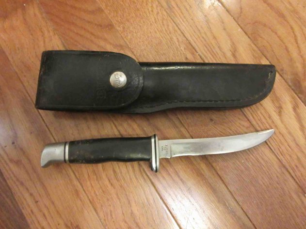Image for Buck knife in leather sheath
