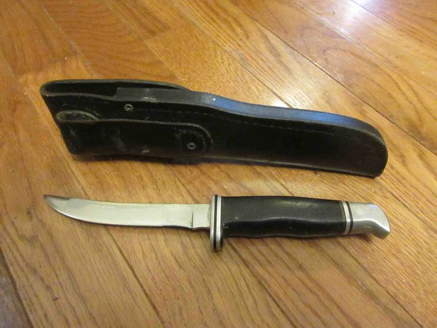 Image for Buck knife in leather sheath