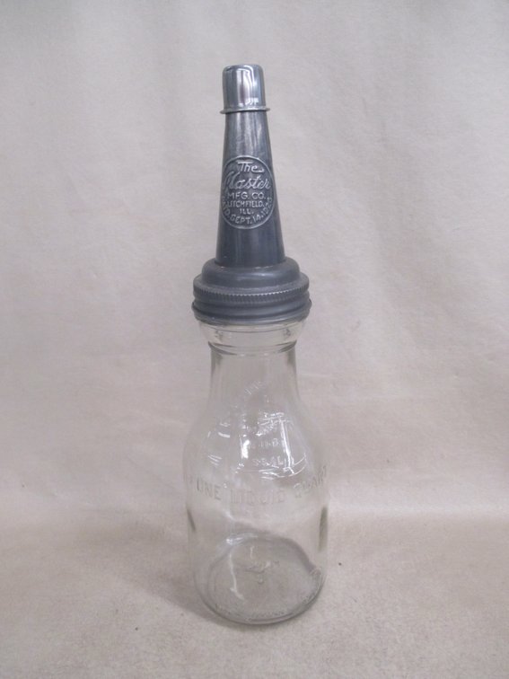 One-quart glass oil bottle with Master embossed pour spout lid