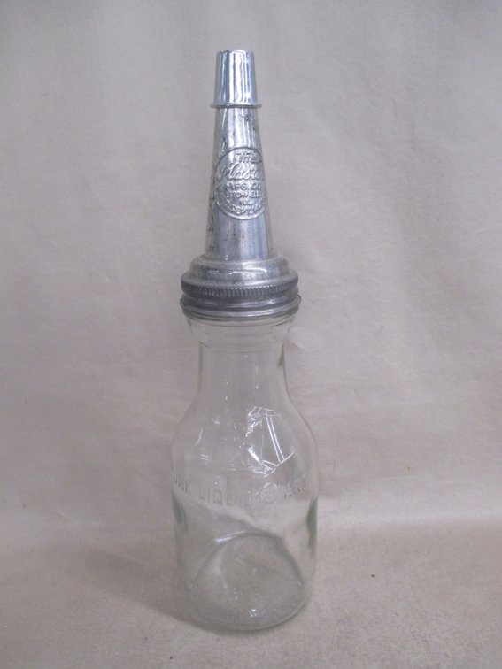 One-quart glass oil bottle with Master embossed pour spout lid
