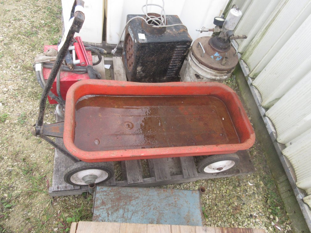 Radio Flyer metal red wagon, rusty inside