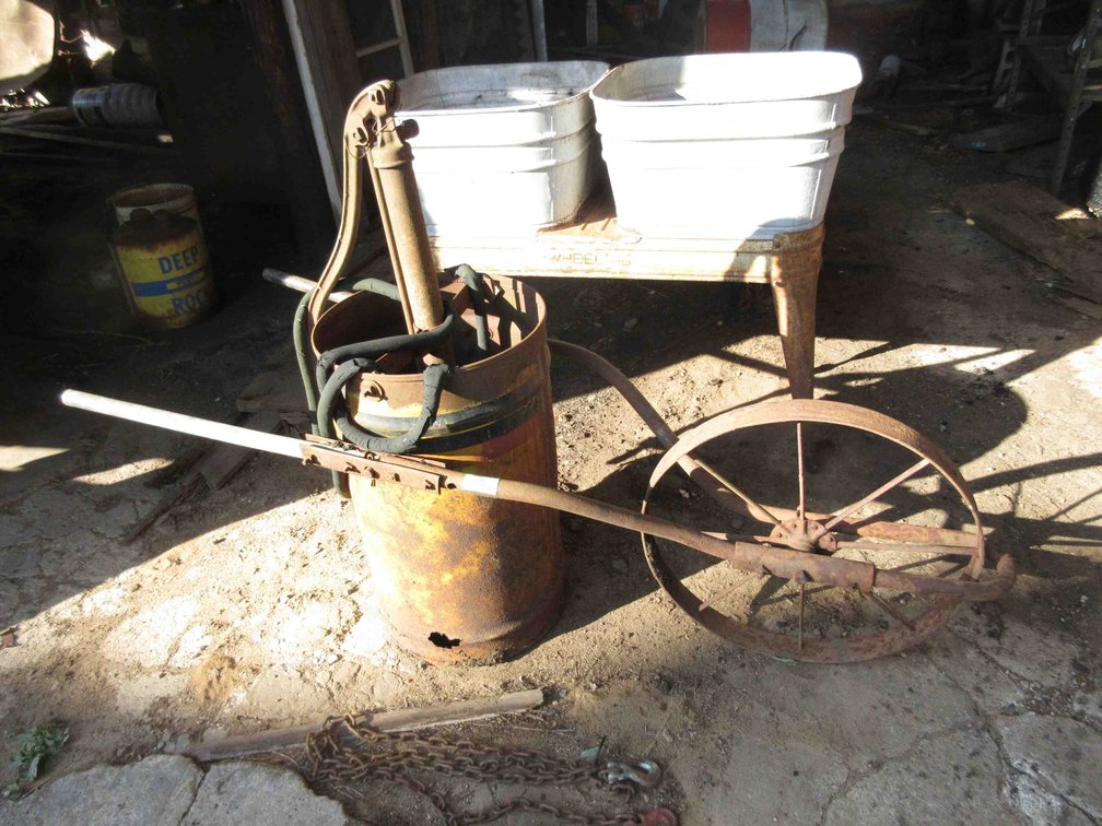 Antique oil pump on cart
