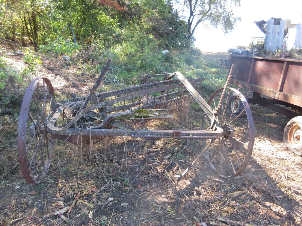 Antique dump rake with steel wheels
