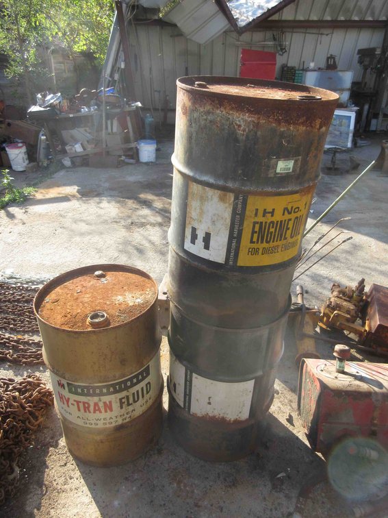 (3) International Harvester steel barrels
