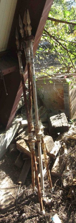 (4) Iron fence posts
