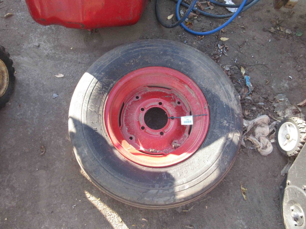 Machinery tire on rim