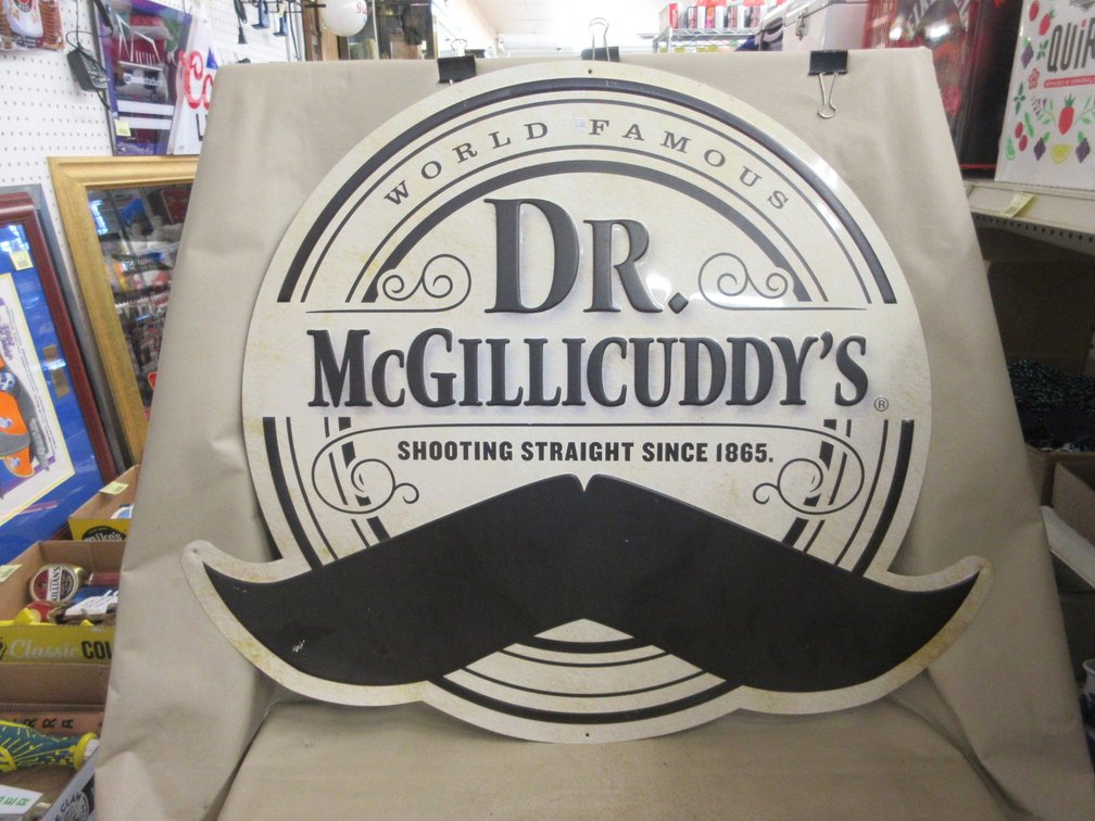 Dr.McGillicuddy's metal wall hanging