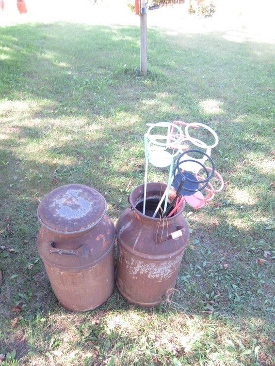 (2) Milk cans with lawn cup holder stakes