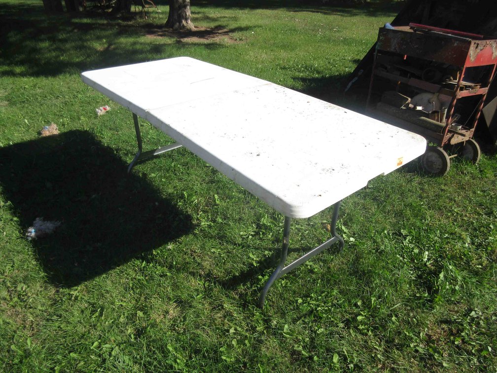 Plastic folding table