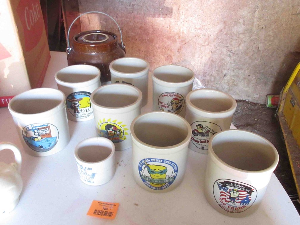 Group of souvenir Ellsworth Cheese Curd crocks and unmarked bean pot
