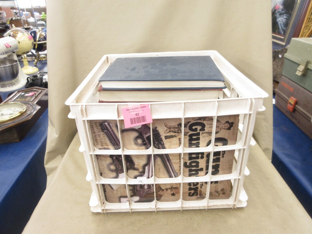 Plastic crate of firearms books