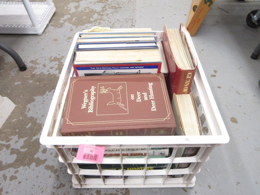 Plastic crate of firearms books