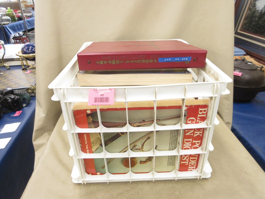 Plastic crate of firearms books
