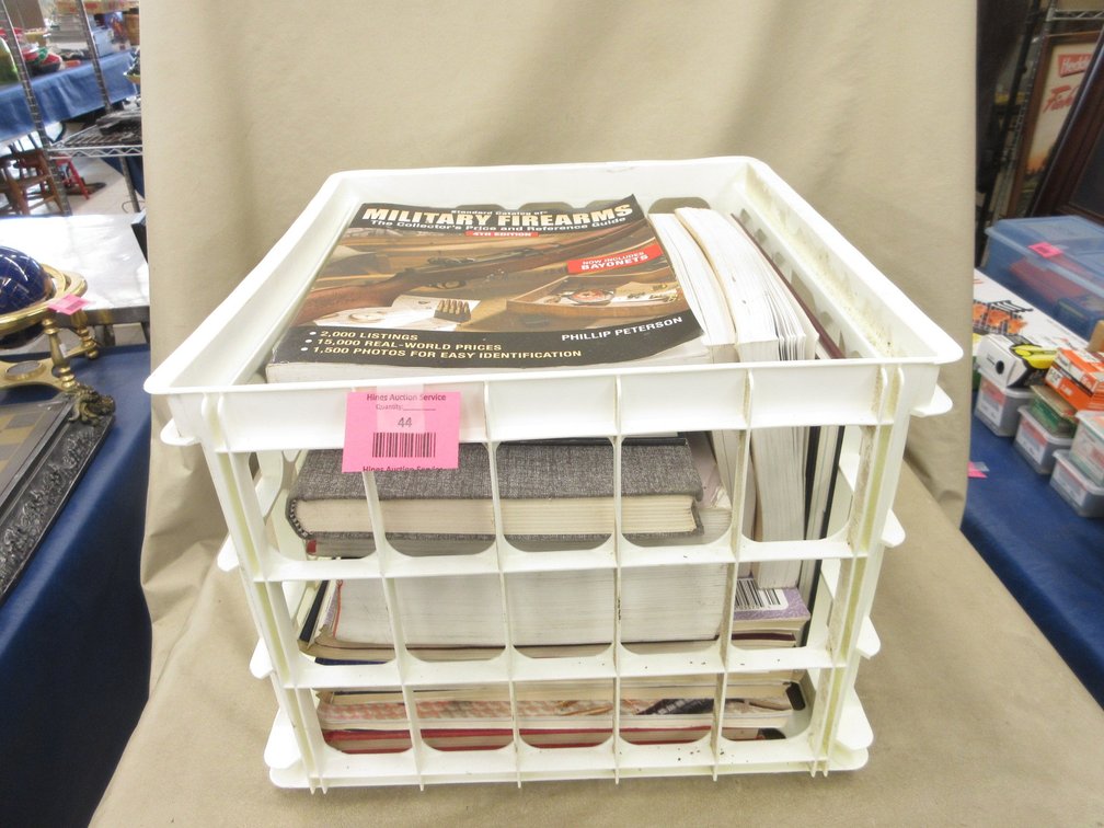 Plastic crate of firearms books
