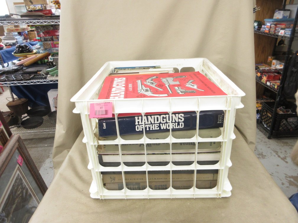 Plastic crate of firearms books