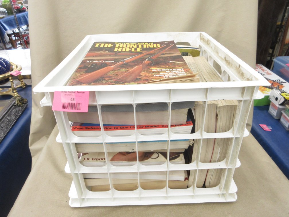 Plastic crate of firearms books