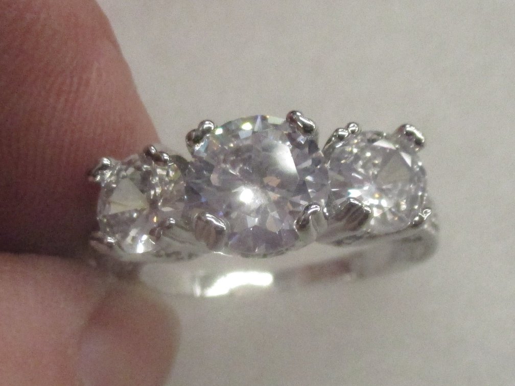 Costume jewelry silver tone ring with CZs