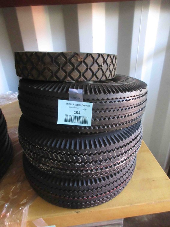 (3) New utility tires on rims and (1) small tire