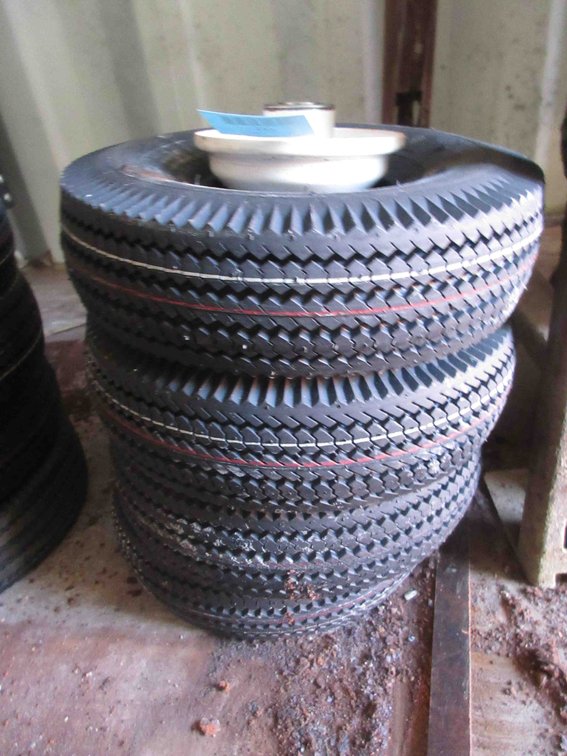(4) New utility tires on rims