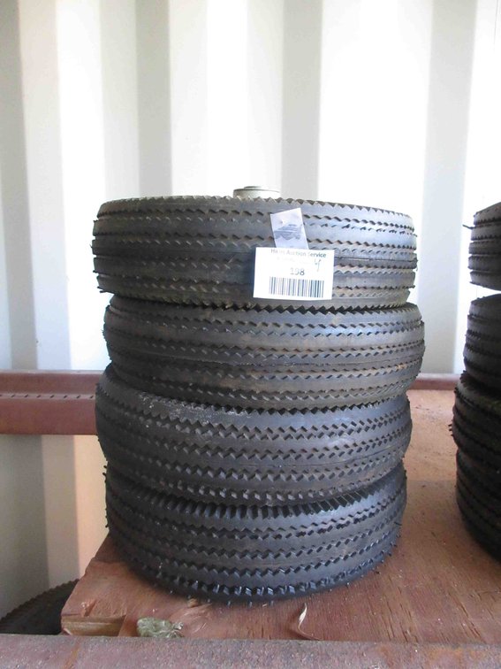 (4) New utility tires on rims
