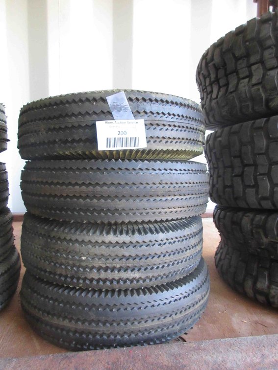 (4) New utility tires on rims