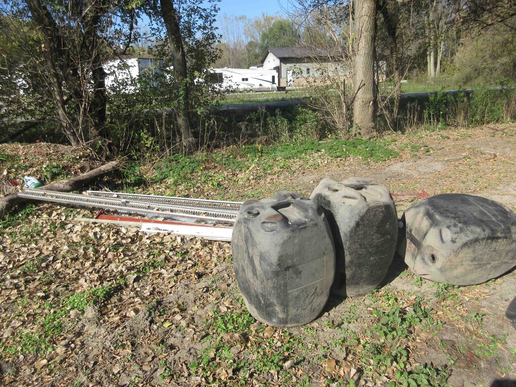 Group of steel and plastic barrels