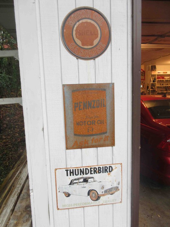 (4) Metal signs on garage