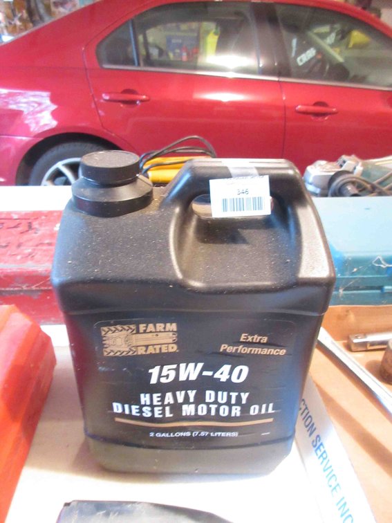 Jug of Farm Rated 15W--40 diesel motor oil