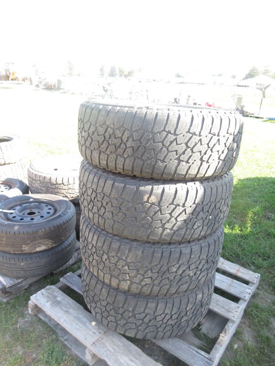 (4) Falken Wild Peak A/T tires on chrome rim