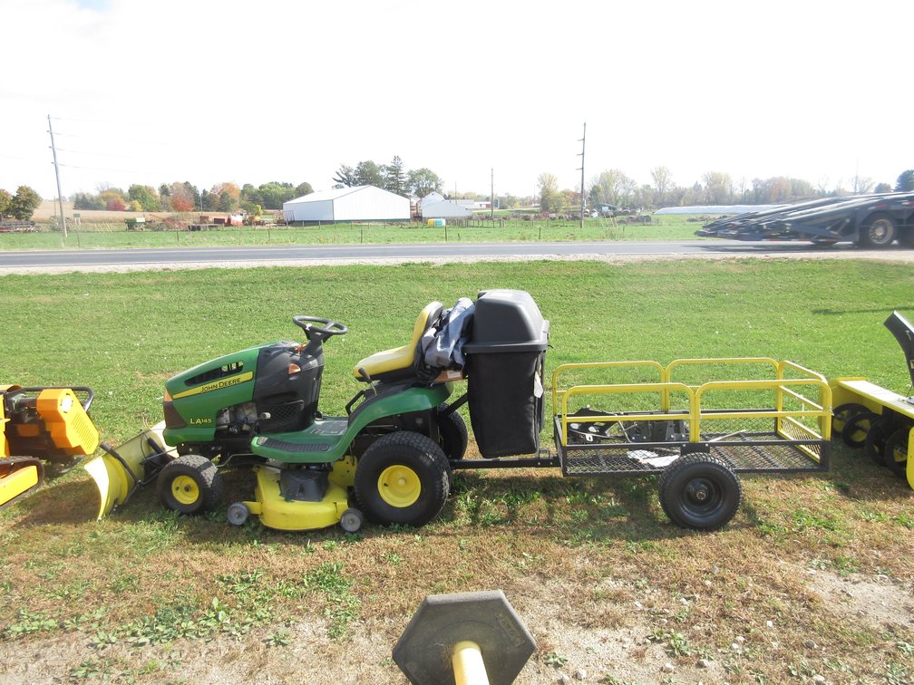 John Deere LA145 riding mower with bagger, yard wagon and front blade