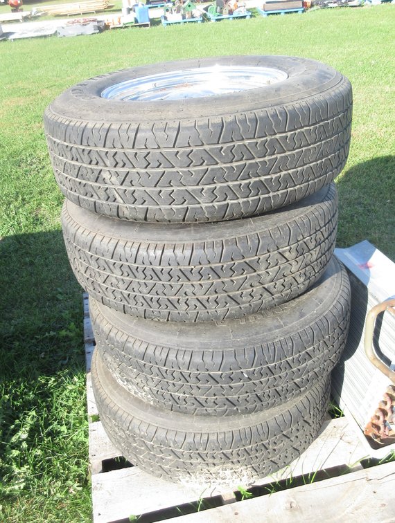 (4) Formula Road and Trac tires on chrome smoothly uni-fit rims with hub caps