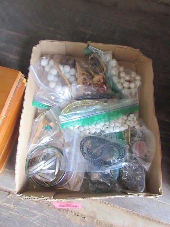 Flat of costume jewelry