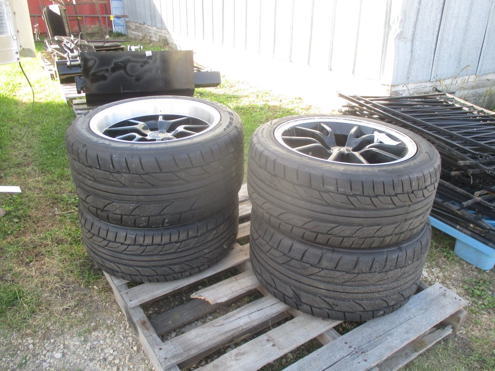 (4) Custom Tires and rims off of 2001 Mustang, (5) hole rims