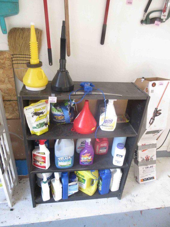 Pressed wood shelf with contents