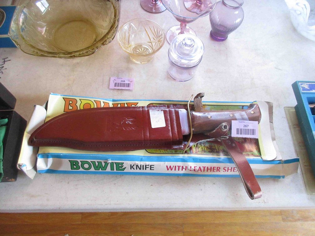 Bowie knife in leather sheath