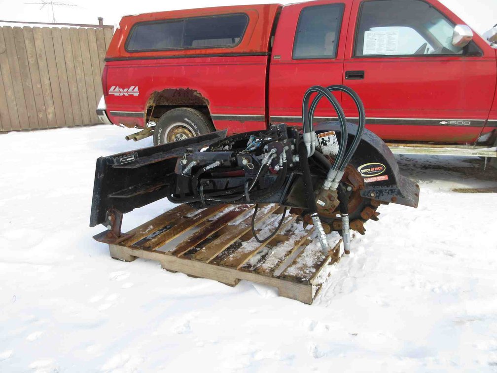 Quick Attach brand skid steer stump grinder