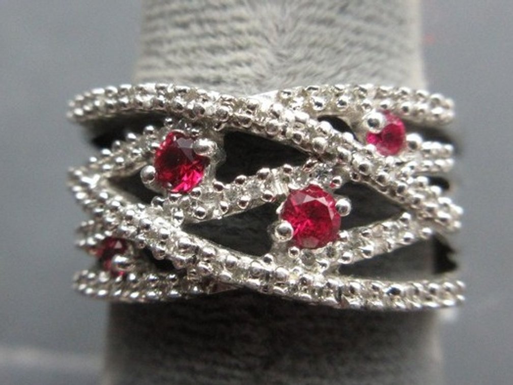 JWBR sterling silver.925 synthetic diamond and ruby entwined ring