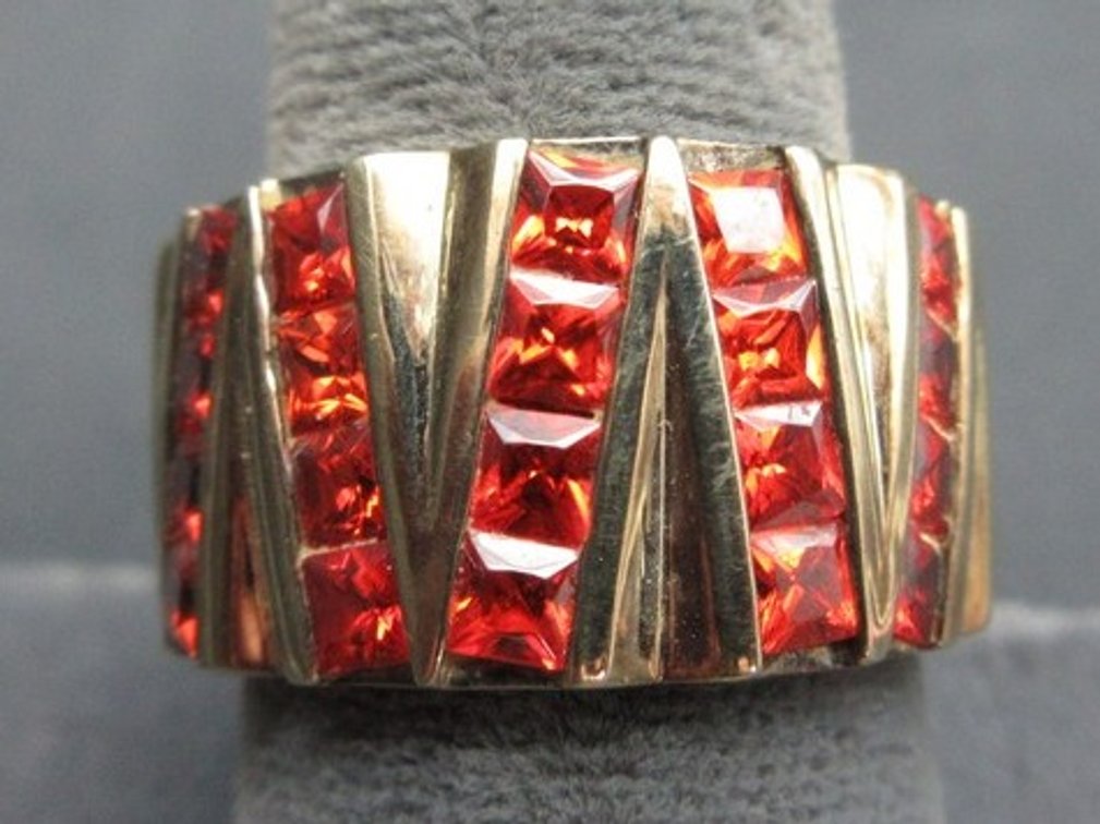 .925 Canada marked gold-tone ring with orange baguette stones