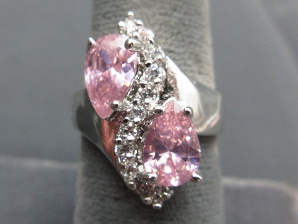 Marked .925 silver ring with pear-shaped pink stones and cz