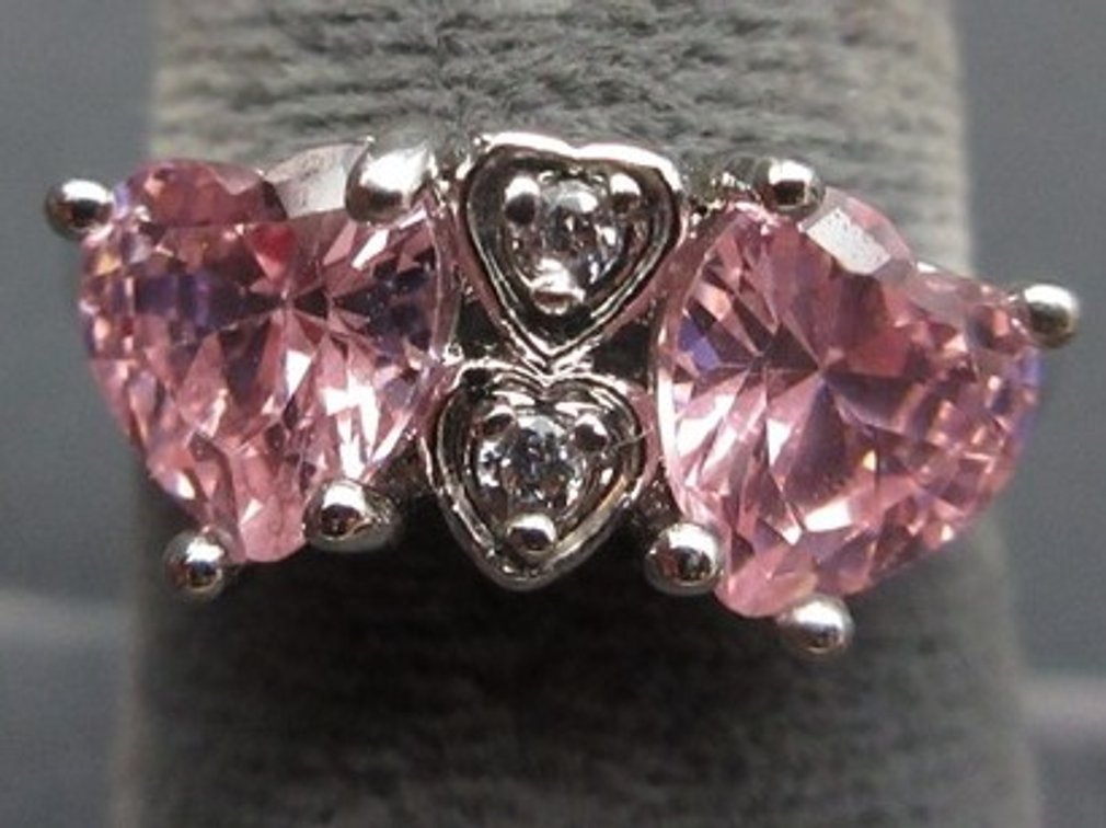 .925 Marked silver ring with pink heart-shaped and clear stones