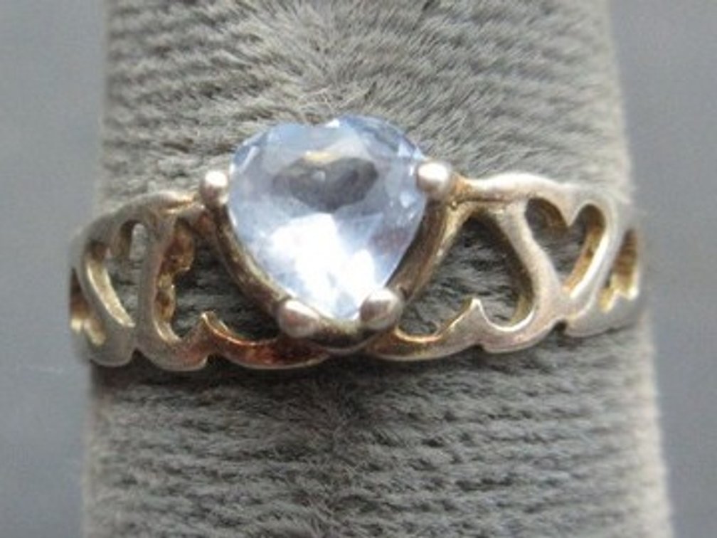 Marked .925 Italy ring with light blue heart stone