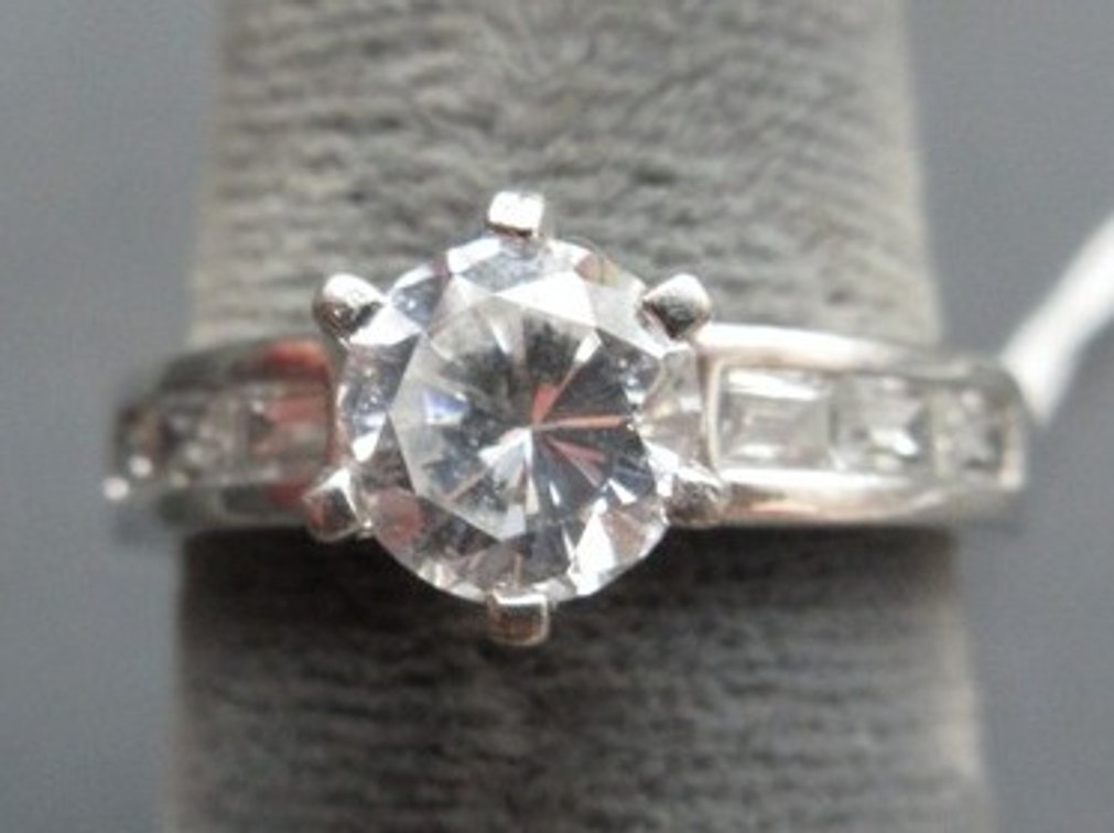 Marked .925 NV engagement-style ring with CZ stones