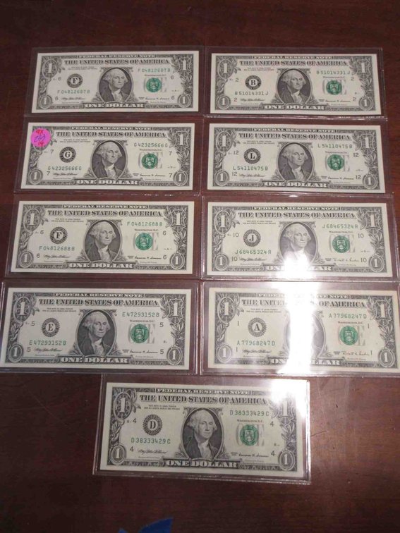(9) Uncirculated $1 US Federal Reserve notes