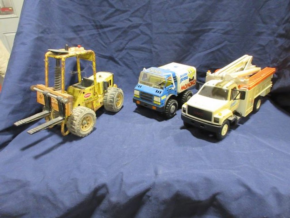 (3) Vintage toy trucks