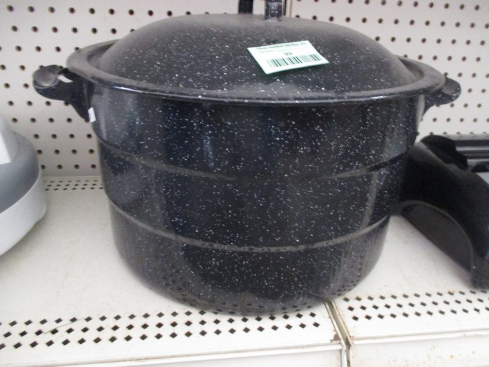 Enamel canning cooker with contents