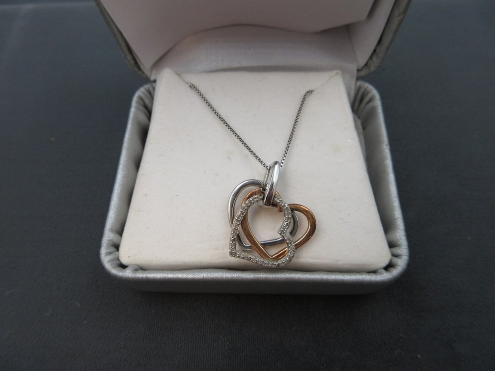 Sterling and mixed metal open hearts pendant on sterling silver chain