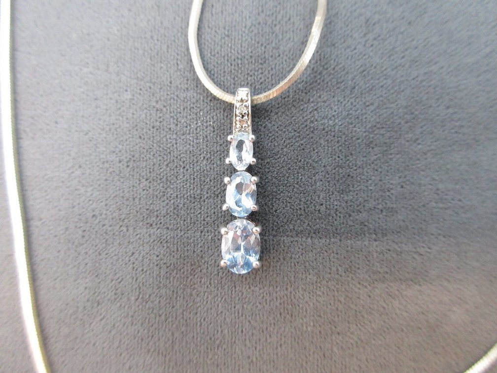 Ross Simons blue topaz and diamond pendant on 18" .925 chain