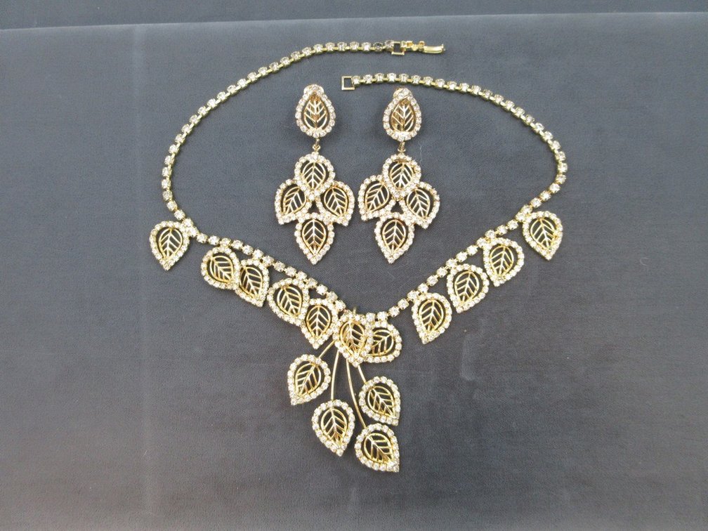 Gold tone and rhinestone necklace and earring set