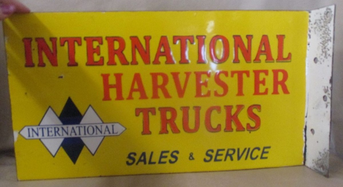 Porcelain on steel 2-sided "International Harvester Trucks Sales & Service" sign